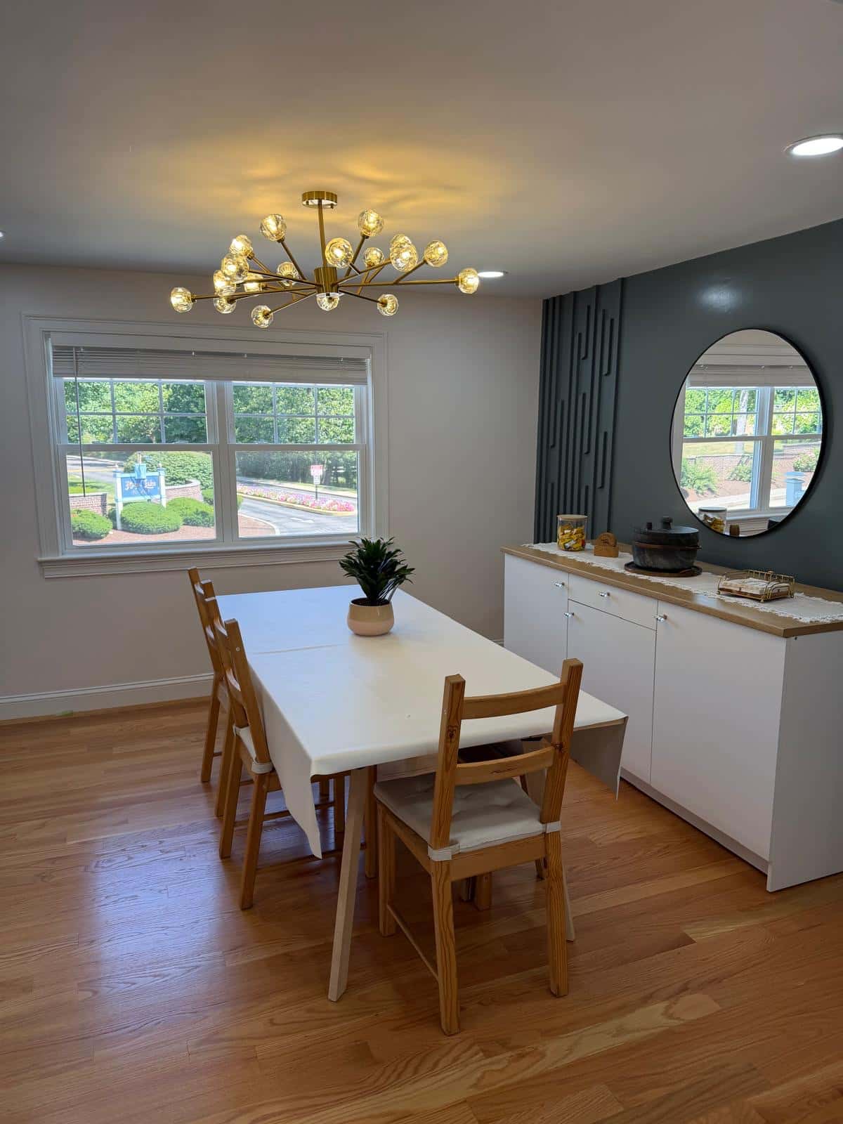Bright dining room with a sideboard and hardwood floors after a cleaning visit