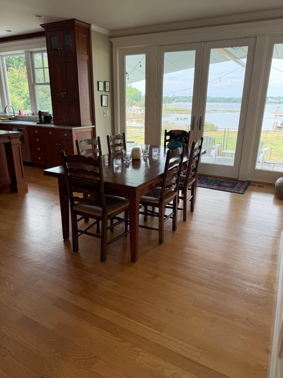 Clean open kitchen and dining area in a waterfront South Shore home
