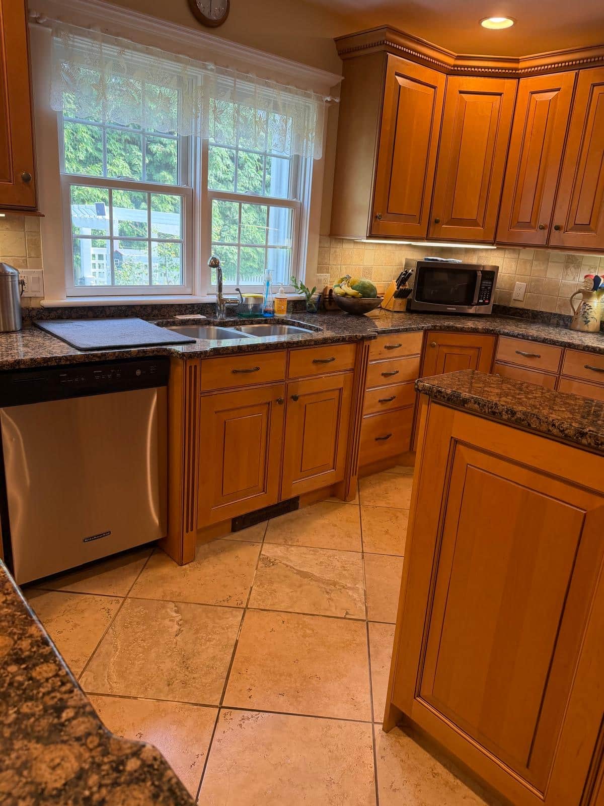 Kitchen sink, dishwasher and tile floor cleaned during a recurring visit